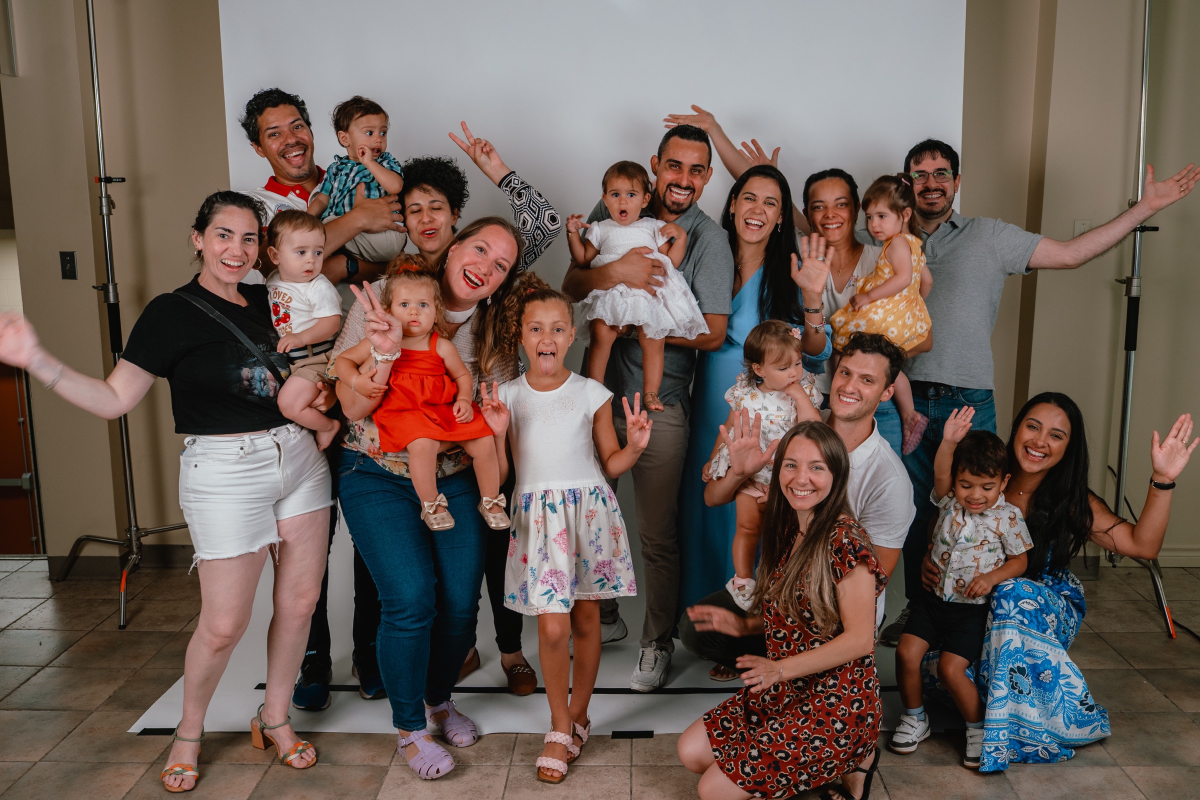A large group of families posing together after a Parent Child Dedication service