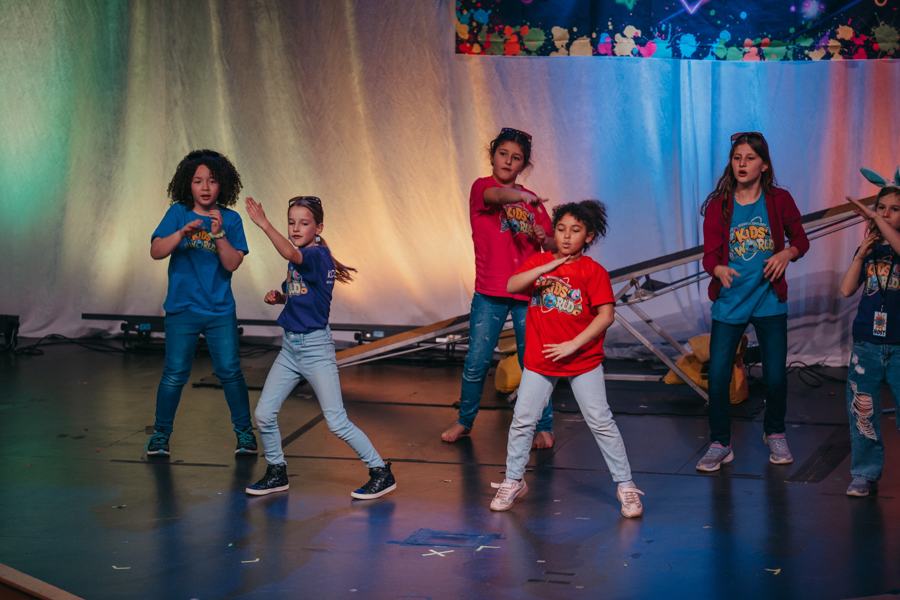 Kids dancing together on stage at Easter Blast