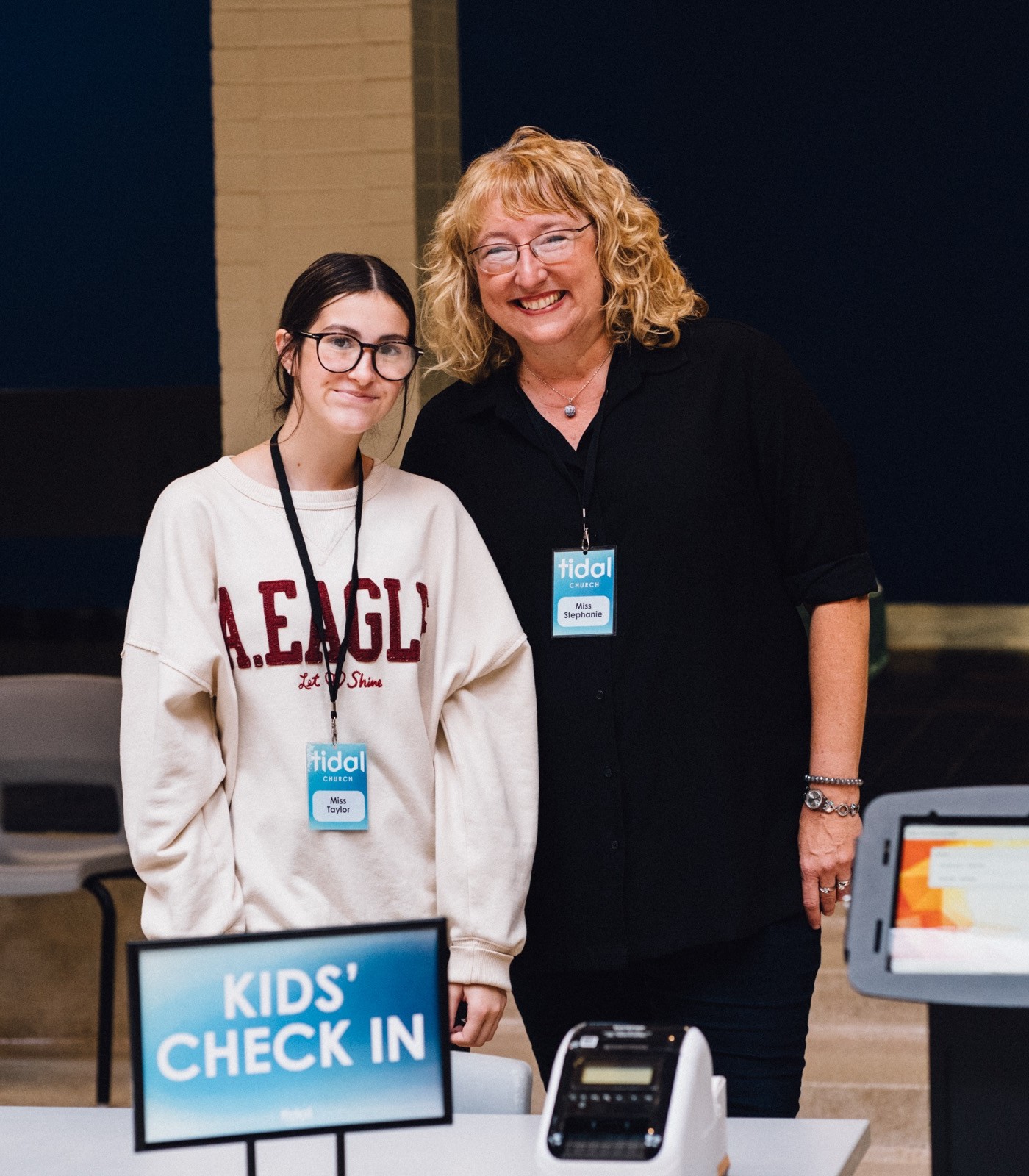 Kids' Check In volunteers welcoming families at the Shediac campus