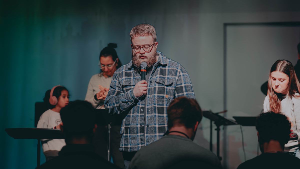 A youth pastor speaking to students