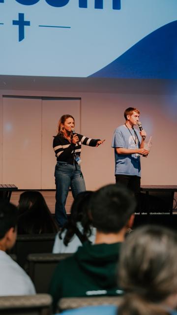 Youth leaders speaking on stage at Tidal Youth