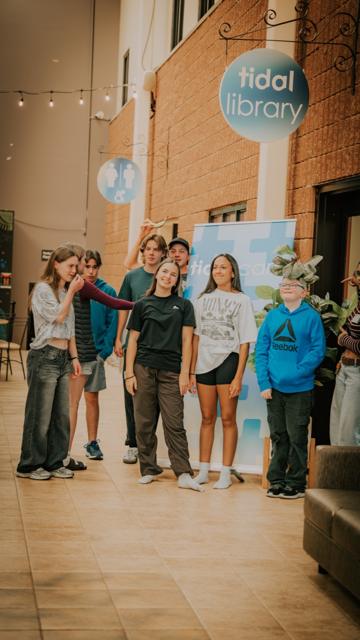 Tidal Youth students taking a photo together near the Tidal Library