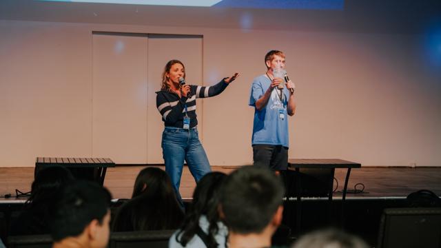 Youth leaders speaking on stage at Tidal Youth